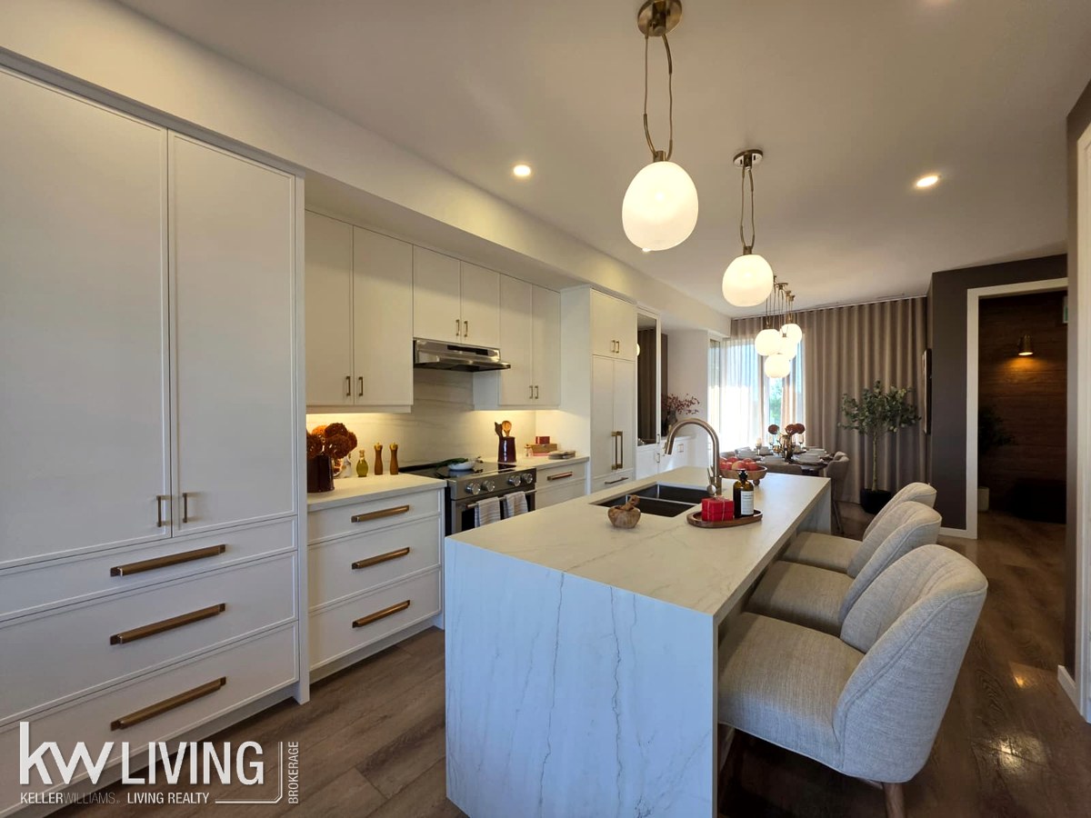 AVELLA model suite kitchen and dining area
